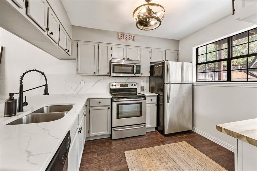 Welcome to this beautifully updated 2-bedroom, 2.5-bath condo in the highly desirable Shadowood Trail Condos, perfectly located just blocks from shopping and dining. This light-filled home offers the ideal blend of comfort, style, and convenience. The kitchen shines with quartz countertops and backsplash, upgraded cabinet hardware, and stainless steel appliances, creating a sleek and functional space for everyday living and entertaining. Each spacious bedroom features its own private ensuite bath with quartz vanity tops, skylights for natural light, and generous walk-in closets. Recent updates include new windows, new fencing, and modern light fixtures throughout, adding both value and peace of mind. The utility closet is conveniently located in the hallway between the two bedrooms for easy access. Step outside to enjoy a private top-floor deck, plus a covered patio with additional storage, perfect for relaxing or hosting friends. This move-in ready condo offers low-maintenance living in an unbeatable location.