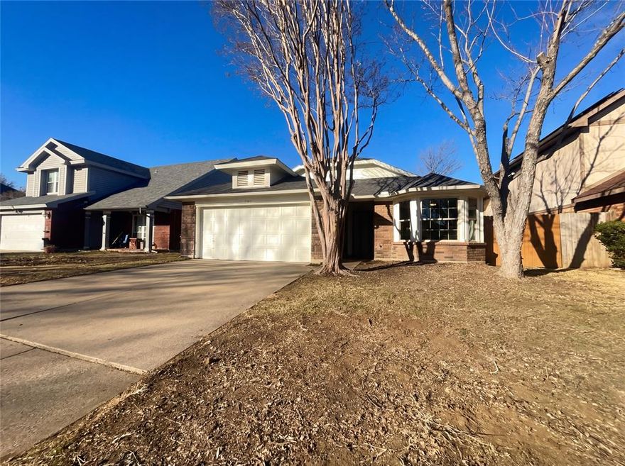 Welcome to 2108 Woodland Oaks Dr, a property that exudes warmth and sophistication. The centerpiece of the living area is a charming fireplace, perfect for cozy evenings. The kitchen is a chef's dream, boasting new appliances that ensure efficiency and convenience. All appliances are stainless steel, adding a sleek, modern touch to the space. Step outside to a covered patio, ideal for entertaining or simply enjoying a quiet cup of coffee. The backyard is fully fenced, providing privacy and peace of mind. This property is a perfect blend of comfort and style, waiting for you to make it your own. Home comes with a 100-Day Home Warranty and a 7-Day Home Test Drive to move in 7 days early for free