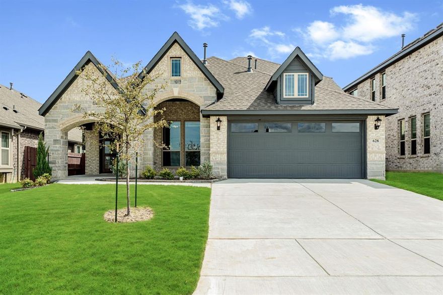 READY NOW! Hosts 4 bdrms, 3 baths, & gorgeous open common area w soaring ceilings & window-lined walls. Upgraded Stone & Brick exterior featuring large front sitting porch provides ample curb appeal. Upon entering the upgraded 8' custom front door, you'll find chic Wood-look Tile floors in common areas and Study off of the entrance w dual doors. The study could be used as formal dining. The center of the home is the Deluxe Kitchen that includes gas cooking on built-in SS appliances w an island layout. Laminate Wood floors adorn the common areas, and Painted Cabinets & Quartz tops throughout. Primary Suite & 2 bdrms on first floor; Bed 4 & Bath 3 upstairs off the Game room provide a private retreat. Game room has a built-in tech center & an overlook down to the kitchen & living space. Buffet added to dining space, Covered Rear Patio, separate laundry room, gutters, and multiple energy-efficient features. Visit Bloomfield at Godley Ranch today to see all this home has to offer!