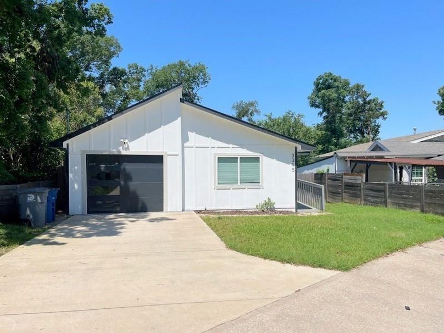 Modern four bedroom two bath home nestled in the heart of the thriving Trinity Groves neighborhood! Open concept living and dining area! Kitchen with breakfast bar-island combo, granite countertops, tile backsplash, stainless steel appliances and plenty of storage space! Primary bedroom has an ensuite bathroom featuring two sinks, shower and walkin closet. Other three bedrooms are nice sized. Home features decorative wall installations, luxury vinyl plank and ceramic tile flooring. Enjoy evenings on the back deck overlooking the fenced backyard! One car garage! Convenient location to downtown allows you to experience city living in this quiet, established neighborhood. This is a must see!