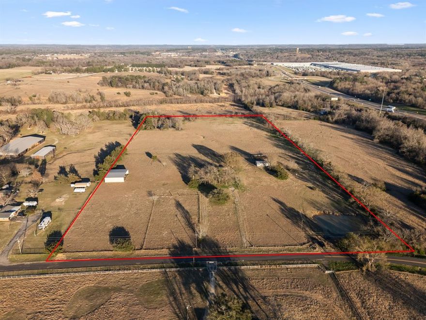 20 ACRES with access off Interstate 20 and Loop 49 Intersection access road, CR 411 road on north side of I20. Property on East side of CR 411.   Currently outside city limits. Will divide. Current use ag. Less than one fourth mile to 49 & 20 intersection. Another 71 acres directly across the street (westside of 411) also available with premium I20 access road frontage. Small pond onsite.