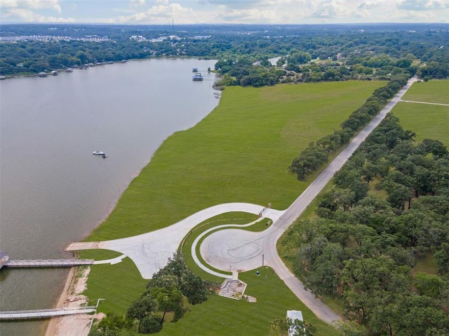 Discover Lot 5 at Waterfront on Park — a rare 1.36-acre homesite in an exclusive community on the tranquil, south-facing shores of Eagle Mountain Lake. Once a beloved city park, this private enclave now features just 16 premium lots with direct lake access for swimming, boating and fishing, and breathtaking water views. Enjoy the serenity of lakeside living just minutes from vibrant downtown Fort Worth. This is your opportunity to create a custom retreat in a setting where nature, privacy, and convenience converge.