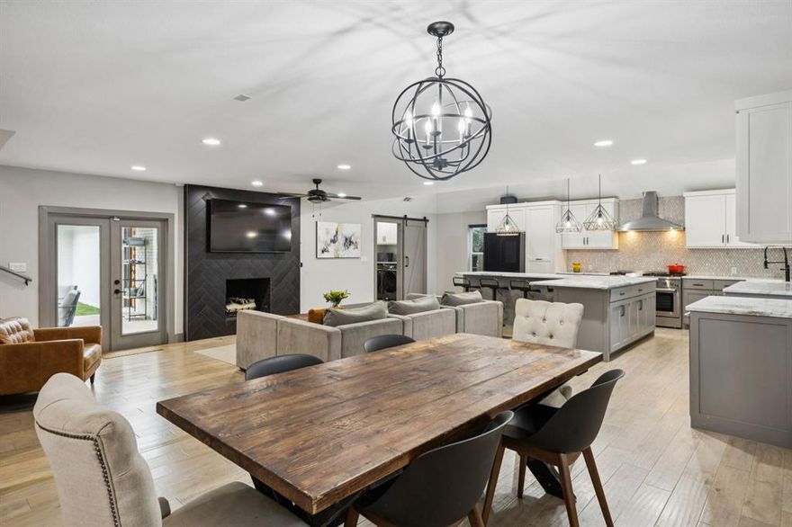 Completely owner updated, every surface of this spacious two story home has been touched. One of the best kitchens on the market - open concept, ample counter space, custom cabinets and upgraded appliances. It’s an easy place to gather and linger. The main living room and formal dining room are steps away and just down the hall, an incredible game room. Added in 2023 and spray foam insulated (even the walls), this room is so large you can add workout equipment and still have space for a second TV, sectional and every type of arcade game you can imagine. A dedicated utility and built-in work desk separates the space and makes the absolute most out of every inch. The primary bedroom is tucked on the first floor with a closet the size of a room. Upstairs you’ll find four - FOUR - additional bedrooms making this an ideal layout for families, work-from-homers, downsizers with room for long-term guests and more. The electrical has been updated, all windows replaced and upgraded with privacy tint, continuous engineered hardwoods throughout all main living areas, fresh paint, timeless marble countertops, a HUGE backyard, low maintenance, evergreen artificial grass, the garage has been extended, a golf cart entrance added and an electronic gate to create privacy and a private basketball court if desired. Both HVACs and the hot water are 2023 or newer. The patio is covered and wired for TV making it a third living room nine out of twelve months during the year. Exceptional home at an incredible price point. Make this one your own.