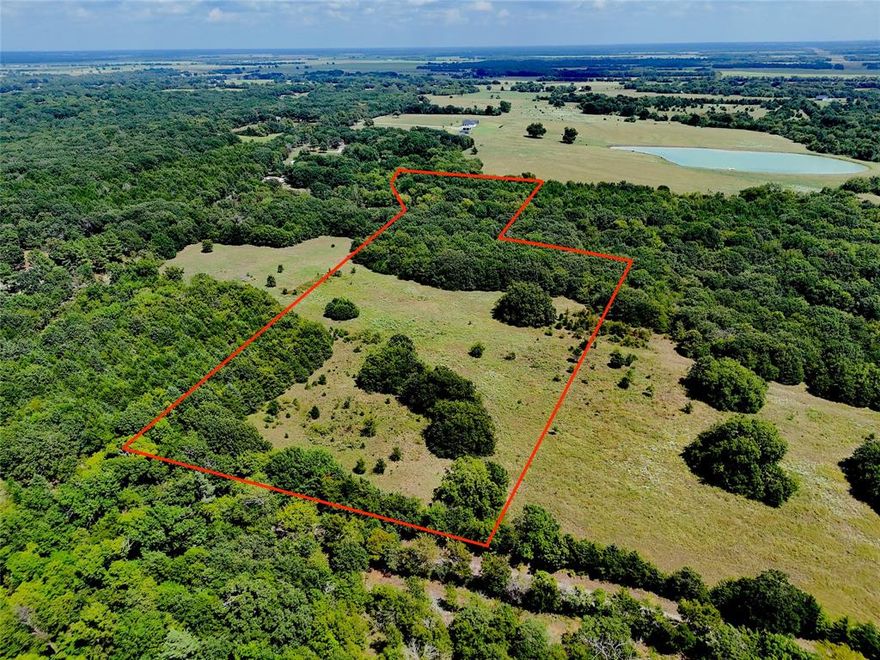 Take a look at this peaceful escape, just outside of town. 13 acres located near the thriving Bois D Arc Lake! In minutes you can have your boat launched from the Fm 1396 boat ramp and enjoy the excellent opportunities Bois D Arc has to offer. This is a unique and property with a great meadow up front, featuring mature pecan trees and all the charm you need for your estate style build. Very well maintained county road frontage along western side.  Utilities are readily available. 45 minutes to Mckinney.