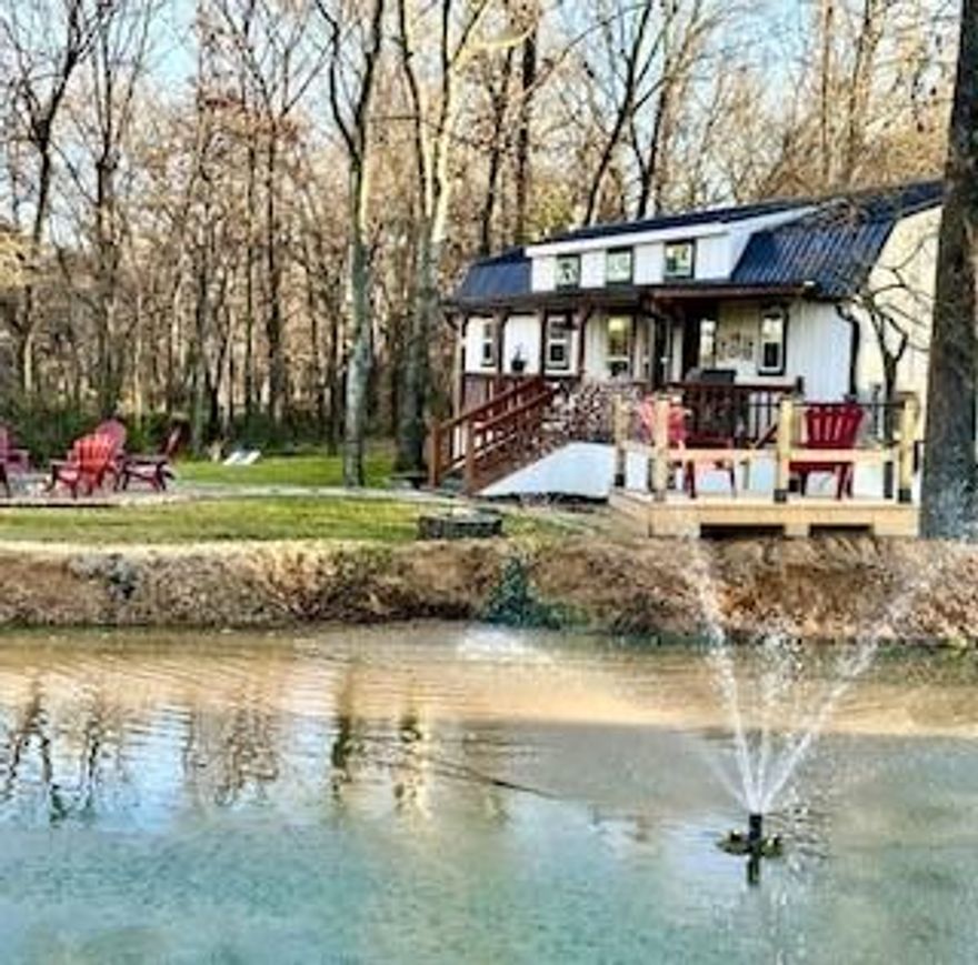 Most beautiful AirBNB property in Mineola and SO close to the Mineola Nature Preserve, you can literally look out your front door and see it!! Looking for a short-term income-producing property? Want to own your own Airbnb in historical Mineola? Or maybe just that perfect cabin in the woods to get away from the hustle and bustle? This cozy 2 bed 2 bath cabin sitting on almost an acre is exactly what you're looking for. Built in 2023 with front and back porches built for enjoying the peace and tranquility of the country, as well as a pond with a fountain, the perfect firepit for the cool winter evenings, this spot will take your breath away. Only minutes from historical downtown Mineola and across the road from the 2,000+ acre Nature Preserve, you won't find a better location anywhere in Wood County.