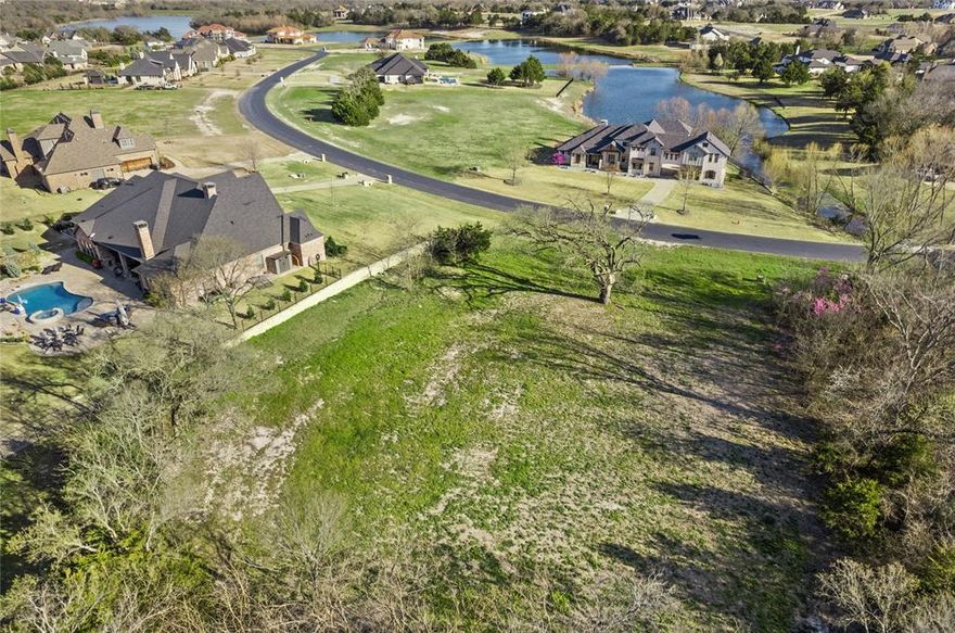 Great lot in Melissa ISD with a water view! Lot cleared, rough graded and ready to build your dream home! 1.3 acre lot in a Gated Luxury Community. Upscale country living at its finest but close enough to all the metroplex has to offer. Easy access to McKinney and DFW! Neighborhood has access to 4 lakes, ponds, a covered private fishing pier, lakeside parks, soccer fields, picnic pavilion, and basketball courts. Come see today!