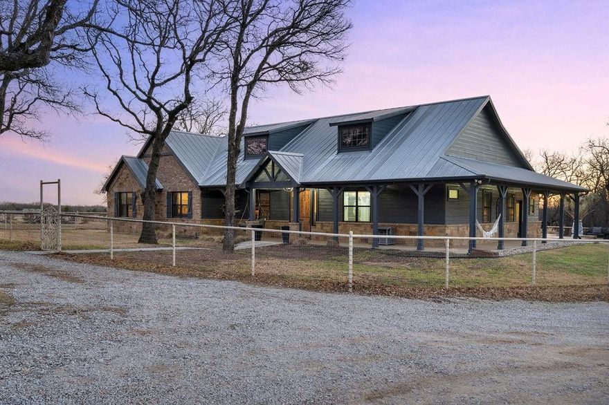 Set on 10.5 picturesque acres, this stunning modern farmhouse blends elevated design with wide-open Texas living. The 4 bedroom, 2.5 bath home offers thoughtful upgrades throughout, creating a warm yet refined retreat.

Step outside and experience what truly sets this property apart, a resort-style pool, expansive covered patio, outdoor kitchen, and multiple outdoor living spaces designed for effortless entertaining. The wraparound porch is the perfect place to start your mornings with coffee and end your evenings watching breathtaking sunsets.

The fully fenced acreage is ideal for cattle and currently benefits from an agricultural exemption, keeping property taxes low. A large garage - shop provides ample space for hobbies, equipment, or business use, plus there’s room to park RVs, boats, and additional vehicles with ease.

Peaceful country living, modern comfort, and unforgettable sunrises and sunsets all just waiting for its next owner.
