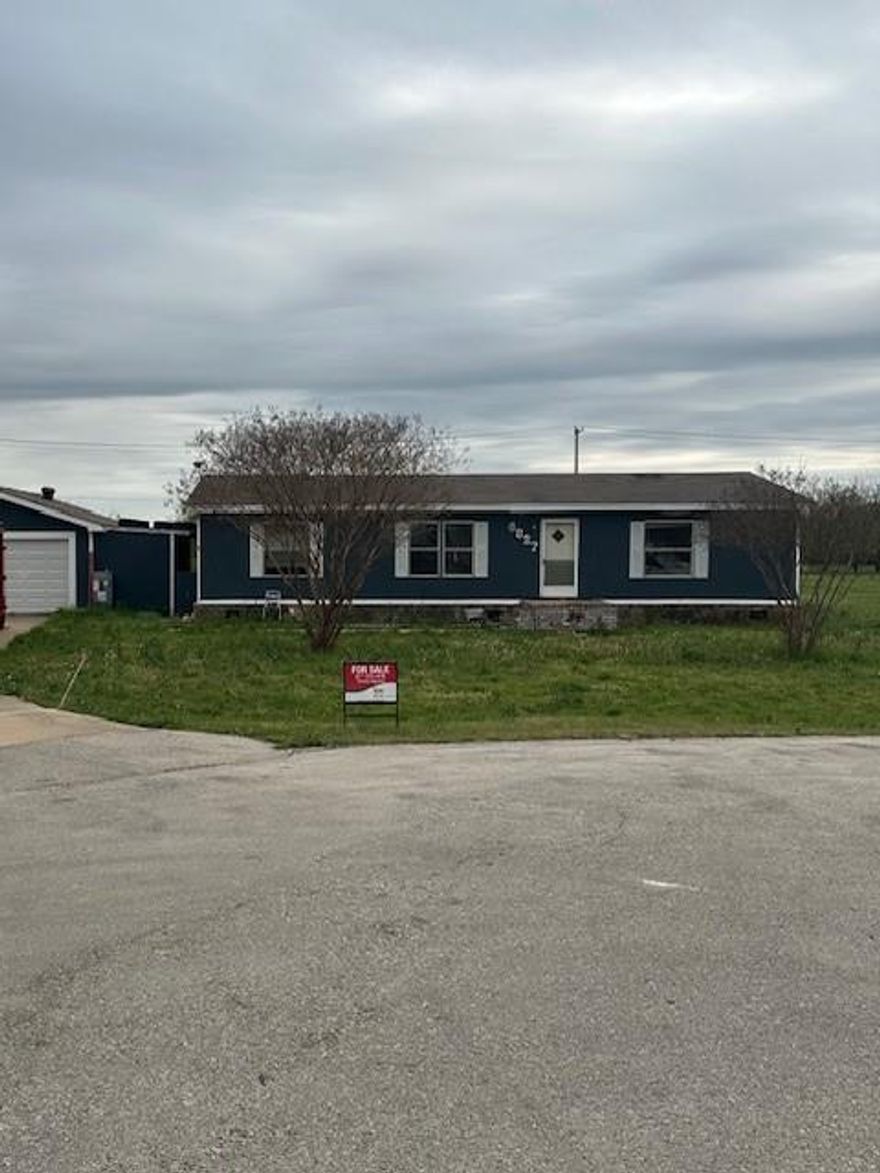 Double-wide manufactured home on 1 acre of land in Krum, TX with great potential. Property is in need of updates and is being sold as-is. Existing flooring has been removed, offering a blank canvas for the new owner to install their own finishes and design. Ideal for investors or buyers looking to customize a home to their taste. Spacious lot with room to expand or improve. Buyer to verify all information.