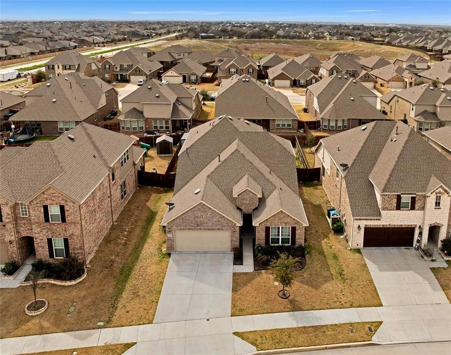 Welcome to a beautifully designed 2021 Pulte home featuring the popular Mooreville floor plan, located in the highly sought-after Northwest ISD. This thoughtfully designed home offers the perfect balance of space, comfort, and flexibility with 4 bedrooms and 3 full bathrooms, including two bedrooms downstairs and two upstairs. The layout was built for modern living, featuring two dining areas, a private den ideal for a home office, & a dedicated media room perfect for movie nights, gaming, or entertaining guests. The open design creates a seamless flow for everyday living while still offering separate spaces to work, relax, and gather. Step outside to a covered back patio currently set up with comfortable outdoor seating, making it a great space to unwind or host friends and family. The tandem two-car garage adds incredible functionality with refinished garage floors and built-in cabinetry for extra storage. A standout feature is the permanent Govee smart lighting installed on the exterior, allowing customizable lighting for holidays, game days, or everyday curb appeal. A modern layout and a fantastic location make this home one you won’t want to miss.