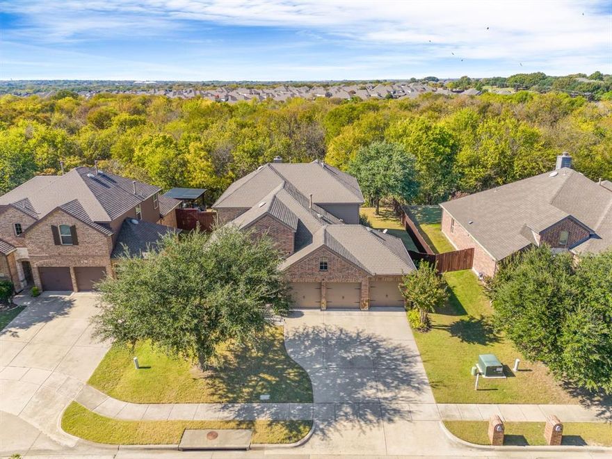 Perfection x 3: A Beautiful Wooded Greenbelt Lot with Mature Treeline Views ~ Room for a Future Pool ** Zoned to Outstanding Prosper ISD ** Close to McKinney Shopping, Dining, & Baylor Hospital. Located in the Reserve section of Summit View Lake, this residence is meticulously maintained both inside & out. 4 spacious bedrooms, 2 dining areas + a dedicated office with French doors & a flex room off the kitchen ~ ideal for a 2nd office, playroom, homeschool classroom, exercise or craft room. Big gameroom upstairs separates 3 spacious upper bedrooms. At the heart of the home ~ a spacious kitchen with stainless appliances, including the refrigerator, is designed for cooking & conversation + connected to the cozy family room, the social hub for casual gatherings. The first-floor primary bedroom also has sweeping treeline views. The backyard offers a living backdrop with vista views, providing endless days of enjoyment on the covered patio while admiring the peaceful setting.  For those who appreciate a tidy garage---storage organizers + an epoxy floor covering the true 3-car garage. Washer & dryer included too. A short distance away, anchored by beautiful Summit View Lake, are 2 community pools, a playground & a fishing dock for residents & their guests to enjoy. Wow!