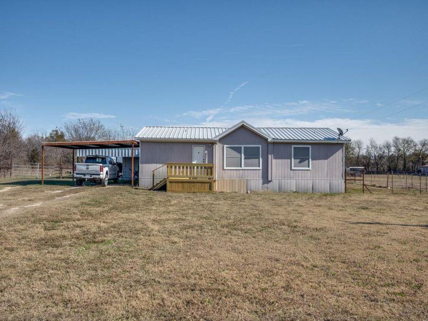 Enjoy the wide open spaces and incredible Texas sunsets in this 3 bedroom, 2 bath home in the country! This doublewide mobile home sits on 1 acre with a huge covered deck and attached shop. So many extras you’ll just have to see to believe! Covered carport , check. Barn with fencing, check. Private Co-op water, check. Front covered deck, check. Potential abounds in this secluded neighborhood. Seller is offering $10,000 towards updates and or closing costs! What are you waiting for??? Schedule your showing today!