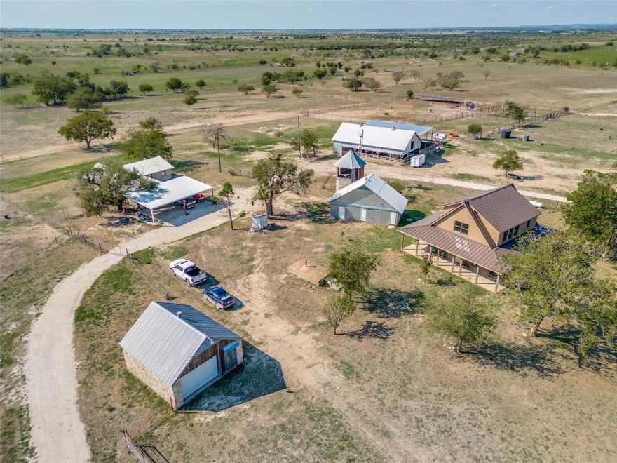 This stunning 620 acre property is the perfect spot to enjoy the beautiful Texas landscape - with space and amenities for your animals as well! The charming two-story cabin with wrap-around porch was built in 2022 and is used as the main residence. The 9ft ceilings create an airy gathering space on the first floor. The kitchen has two separate sinks, open shelving, two refrigerators, an 8-burner gas range, and ample storage. The first floor also has a butler’s pantry, full bathroom, and screened in porch with a soaking tub. The upstairs bedroom has two separate closets, a laundry room, and en-suite bathroom. The large windows offer natural light and gorgeous views of the property. There is also a 2 bedroom 2 bathroom stone house on the property for rental income or separate guest quarters. The acreage and amenities offer space for animals with a covered barn with stalls and attached room for animal medical supplies, additional stalls nearby, feed storage room, and equipment storage.