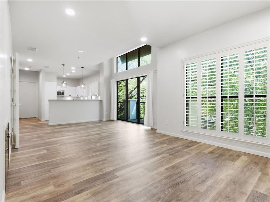 Experience the perfect balance of modern style and urban living in this beautifully renovated Oak Lawn condo, tucked within a quiet, established community. This thoughtfully designed two-story floorplan offers ideal separation with primary bedrooms on each level, perfect for shared living while still maintaining privacy.

The open concept living space is filled with natural light and features updated LVP flooring, creating a warm yet contemporary feel. The fully renovated kitchen showcases granite countertops, updated cabinetry, stainless steel appliances, and modern light fixtures, seamlessly connecting to the inviting living area and cozy fireplace. Work from home in the private office nook off the living room separated by french doors. 

Open the plantation shutters to take in peaceful views of the surrounding mature oak trees, or step outside onto the balcony to enjoy a blend of greenery and city energy below. 

Each spacious primary suite provides comfort and flexibility, both with their own spa-like ensuite baths. The upstairs primary even features its own private balcony. This layout is ideal for guests, roommates, or a home office setup. Additional highlights include in-unit laundry, ample storage, and two covered parking spots in the gated garage. 

Ideally located on the edge of Highland Park near Uptown, the Katy Trail, Downtown, and Love Field—and just minutes from Equinox, Merit Coffee, Drip Coffee, and multiple grocery options—this home delivers the best of convenience and lifestyle in one of Dallas’ most vibrant neighborhoods.