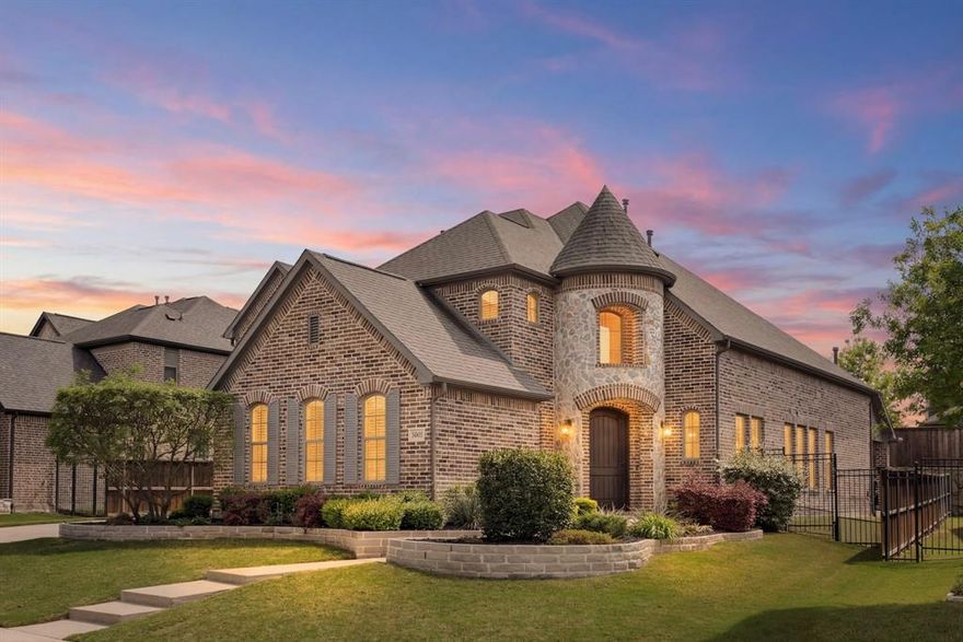 Discover elevated living in the award-winning community of Inspiration! Just moments from Lake Lavon and exceptional amenities including a lazy river, resort-style pools, fitness center, pickleball courts, and access to highly acclaimed Wylie ISD schools. This spectacular Shaddock-built home has been meticulously maintained and thoughtfully updated throughout. Step inside to rich wood floors and abundant natural light that create a warm, inviting atmosphere. With 4 bedrooms, a private office, game room, and media room, the layout is ideal for both everyday living and entertaining. The secluded primary suite and an additional secondary bedroom are conveniently located on the main floor. 
At the heart of the home, a bright all-white chef’s kitchen shines with granite countertops, stainless steel appliances, a gas cooktop, double ovens, and an oversized island—perfect for gathering with family and friends. The open-concept living and dining areas are anchored by a cozy gas fireplace, creating a welcoming space to relax and connect. The spacious primary suite offers serene backyard views. The spa-like en-suite bathroom features dual vanities, a luxurious garden soaking tub, and elegant finishes. Designed with convenience in mind, the suite connects directly to the laundry room, complete with a utility sink and folding space, and is ideally positioned near the mud bench to keep daily routines organized and efficient. Upstairs, enjoy generously sized secondary bedrooms along with a game room and a fully equipped media room featuring a 120-inch screen, projector, and surround sound—bringing the theater experience right into your home. Outside, extensive landscaping and stonework enhance the home’s stunning curb appeal. The three-car garage includes a fully decked and spray foam insulated third bay, offering exceptional storage. Unwind on the covered patio or relax in the hot tub while enjoying the Texas summer evenings. Welcome home to 1506 Mariners Hope Way!