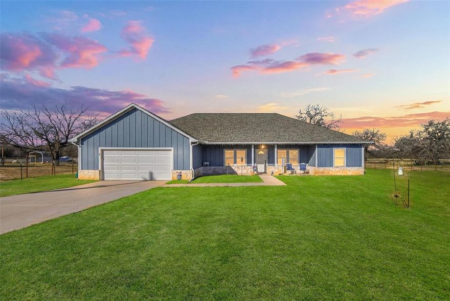 Motivated Seller! Modern living on 2.2 acres with no HOA on a quiet culdesac. Step inside to vaulted ceilings and beautifully stained concrete floors, granite countertops, and quality touches throughout, including soft-close cabinets and drawers. Plenty of extra storage with a large walk-in pantry in the kitchen and a spacious separate laundry room with built in cabinets and countertop.  The property is fenced and gated, perfect for pets, chickens, goats or simply enjoying a little extra privacy. The garage is Texas sized with plenty of space for your SUVs and all your holiday decor. And with the backyard stretching well beyond the back fence line, you have a blank slate to build the backyard you’ve always wanted—garden, fire pit, chicken coop, man cave, she shed or all of the above. You get to choose your school district - Perrin-Whitt or Poolville ISD.