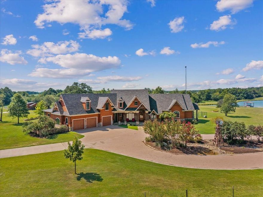 Luxury meets country living on this approx. 44-acre Honey Grove ranch estate! Over 7,500sq ft custom-built home offers 5 bedrooms, 5.5 baths, 2 full kitchens, and 4 living areas—perfect for multi-generational living or guests. Enjoy indoor comfort with, propane fireplaces, industrial gas cooktop, and hot-water heaters. Enjoy the indoor heated endless swimming pool with attached workout room, bedroom or step outside to beautiful fenced and cross-fenced pastures overlooking a stocked fishing pond with covered dock. Additional features include air-conditioned kennels, multiple outbuildings,multiple laundry areas and available additional land and barns. Private apartment offers its own upscale amenities. High-fence security and pasture divisions make it ideal for animals or recreation. A rare combination of luxury, privacy, and Texas ranch living—just minutes from Paris and Bonham! This home leaves nothing out. Owners thought of everything to make this perfect for luxury living and a ranch. Everything is in place for raising all types of animals. Home has triple cable post tension engineered slab.