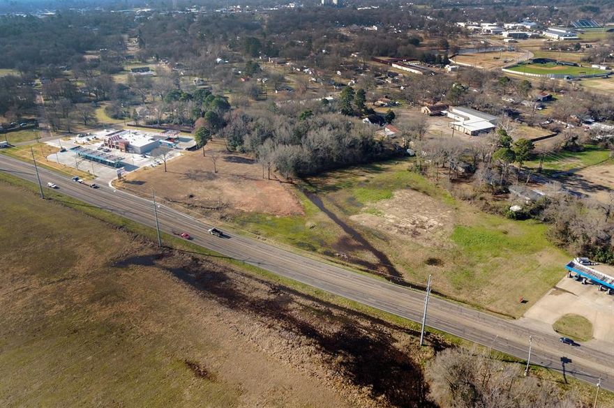 +- 5 acres along Hwy 271 adjacent to the new Whataburger restaurant & Kim’s Convenience Store.
 
Access to Hwy 271 and Mt Pleasant Street. 
Adjacent to the newly constructed Whataburger and Kim's Convenience Store  which has over 250,000 visits in the last 12 months (Placer.ai). 
Ideal for complementary commercial & retail development. 
All utilities available. Zoning: B2 - General Business.