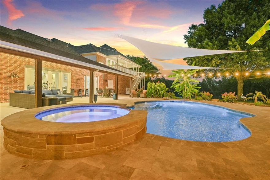 This rare 4-bedroom, 3.5-bathroom estate in Rowlett offers the perfect blend of luxury, privacy, and modern convenience—just steps from Lake Ray Hubbard. Set on nearly three wooded acres directly across from a greenbelt with a forest-like feel, this fully renovated home brings country serenity to the heart of Dallas County. Inside, you'll find an open-concept layout with fresh paint throughout, real wood floors, and custom designer tilework. The kitchen features new appliances, sleek quartz countertops, and seamless flow into the main living and dining areas. The first-floor primary suite is a private retreat with marble bathroom floors, dual room-sized walk-in closets, and a built-in office nook. Even the laundry room stuns with exotic granite counters and bonus space for crafts or storage.

Every major system has been thoughtfully upgraded, including a new impact-resistant roof, smart security with Vivint, smart locks on all exterior doors, and multiple cameras for peace of mind. The home also includes a whole-house water filtration and softener system, energy-efficient and impact-resistant windows, and three newly replaced HVAC systems with Nest thermostats. Outdoor living is just as impressive with a massive covered patio, second-story balcony, full outdoor kitchen and bar, paver patio for a fire pit, outdoor shower, and a sparkling pool with an IntelliChem system that automatically monitors and balances water levels. Additional highlights include a newly built barn, pasture fencing, greenhouse, and an oversized two-car garage ready for projects or storage.

Located in a peaceful pocket of Rowlett with quick access to the lake and local conveniences, this property offers a lifestyle that’s truly one of a kind. If you’re searching for a luxury retreat with land and lake proximity, this is the one you’ve been waiting for.