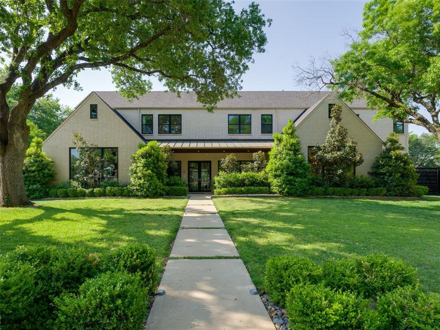 Framed by lush trees and grounded in timeless design, 4046 Northview Lane is a study in livable luxury. This five-bedroom, six-bathroom residence in Midway Hills offers over 5,600 square feet of thoughtfully designed space with clean lines, warm finishes, and natural light throughout. At the heart of the home is an open-concept kitchen featuring quartz countertops, a Porcelanosa backsplash, custom cabinetry, and premium appliances from Sub-Zero, Wolf, and Asko. A hidden prep pantry adds functionality with a second sink, refrigerator, dishwasher, and generous storage—ideal for seamless hosting or everyday ease. The main living area flows effortlessly to a covered patio with built-in grill, sparkling pool, and lounge space designed for year-round entertaining. The downstairs primary suite is a serene retreat with two water closets, dual vanities, a soaking tub, and a spa-like shower. A second ensuite bedroom, private study, and spacious utility room complete the main level. Upstairs, three additional bedrooms, a second living area, and a lofted study offer flexibility for work & leisure. Smart systems control lighting, audio, security, and climate across three zones, while tankless water heaters and LED lighting add to the home's thoughtful efficiency. Located near Northaven Trail, Northaven Park, and some of Dallas' top private schools, this home offers a sense of escape without compromising on daily convenience. Balancing elegance with approachability, 4046 Northview Lane lays the foundation for a life well-lived.