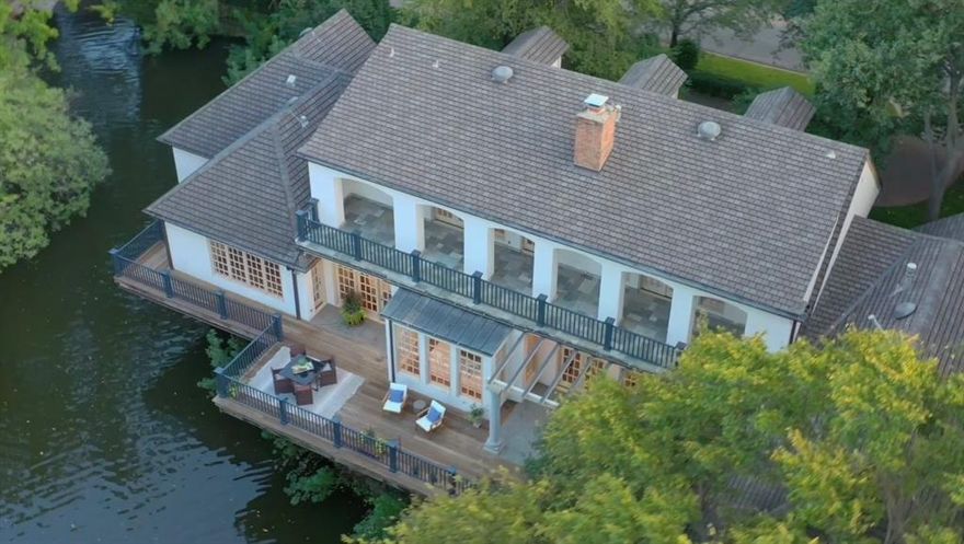 Located on the exclusive enclave known within the community as the Culture Gulch. Custom designed by Richard Drummond Davis, the zero-lot design is low maintenance with high-quality construction. Living areas & master suite all reside on one level. 2 expansive terraces cantilever over the lake provide multiple areas to enjoy nature. Floorplan has great flow for entertaining. Primary suite has two separate marble baths & walk-in closets. 2nd bedroom down could serve as a game room or exercise room. Paneled library-study is handsome & enhanced by a fireplace. Across the street from Curtis Park, UP Pool, tennis courts, space to play with Kids & Dogs. A special place to call home in the heart of University Park!