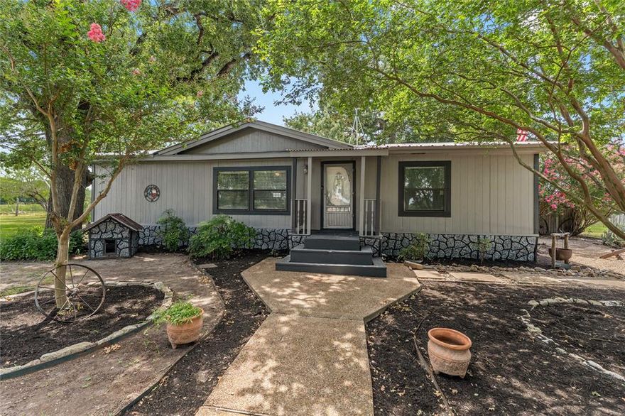 Welcome to your own slice of Texas countryside! Situated on 5.53 beautiful acres in Marlin, this charming 3-bedroom, 2-bath home offers the perfect blend of comfort and rural living. Inside, you'll find a spacious open-concept kitchen and living area.
The property features mature live oak trees that add natural beauty and shade, along with a covered patio that provides a comfortable outdoor space to relax and take in the peaceful setting.

Located just off paved FM 147, you're within 30 minutes of downtown Waco, 45 minutes to Temple, and about an hour from College Station—making it a convenient spot with a rural feel. It is also right across the road from Marlin’s New City Lake.

With no known restrictions, there’s flexibility to use the land how you see fit—whether that’s continuing its current use with goats, building additional structures, or simply enjoying the open space. The property is serviced by Tri-County Water Supply, not city water.

If you’re looking for land, privacy, and room to grow without giving up accessibility, this property is a solid option worth considering.