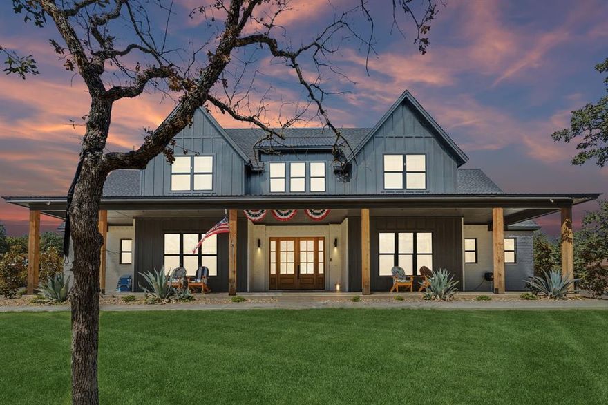 Experience refined country living in this exceptional modern farmhouse set within the peaceful, gated golf course community of Sugartree on the Brazos. Built in 2022, this impressive residence combines timeless design, thoughtful functionality, and luxurious comfort across 3,335 square feet of living space. Step inside to find soaring ceilings, wide-open views, and abundant natural light streaming through large windows that frame the surrounding trees and wildlife. The gourmet kitchen serves as the heart of the home, appointed with granite countertops, stainless steel appliances, a walk-in pantry, and a spacious butler’s pantry for added storage and prep space. The expansive island offers generous room for cooking, serving, or gathering with friends, blending seamlessly with the dining and living areas in an open, inviting layout. Sliding doors lead to the large covered back porch—an effortless extension of the indoor living area—overlooking a tranquil backyard oasis. Here you’ll find a deep pool, easy-maintenance turf, and a dedicated dog run, all surrounded by mature trees that enhance privacy and natural shade. Two private primary suites on the main floor offer versatility and comfort, each designed for relaxation. Upstairs, four additional bedrooms and a large second living area provide flexible space for entertainment, study, or recreation. Laundry rooms conveniently located on both levels add practical ease to daily life. A charming front porch welcomes you home, while the three-car garage offers generous parking and storage. Every element of this property has been carefully curated to create a lifestyle of balance—where modern design meets rustic serenity. From peaceful mornings watching deer roam to evenings by the pool, this home invites you to experience the best of country luxury in one unforgettable setting. Bundled service pricing available for buyers. Connect with the listing agent for details.