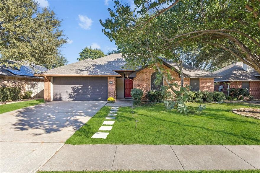 Located in the heart of Denton, this beautiful one-story home has been meticulously maintained and is truly move-in ready. The completely renovated kitchen is a showstopper, featuring sleek quartz countertops, a rich white tile backsplash, deep undermount sink, stainless steel appliances, new range hood, and updated lighting. A sunlit breakfast and dining area with charming bay windows creates the perfect space to start your day. The home features stylish, on-trend wood-look tile flooring throughout—durable, low-maintenance, and elegant. Fresh interior paint in 2023, new AC unit installed  2023 and a new water heater in 2025 add peace of mind. At the heart of the home is a spacious living room with vaulted ceilings and a cozy brick fireplace, ideal for relaxing or entertaining. Enjoy a large fenced backyard with a generous patio and majestic mature shade trees, offering privacy and tranquility. The attached two-car garage provides security, extra storage, and everyday convenience. Schedule your private showing today—this Denton gem won’t last long!