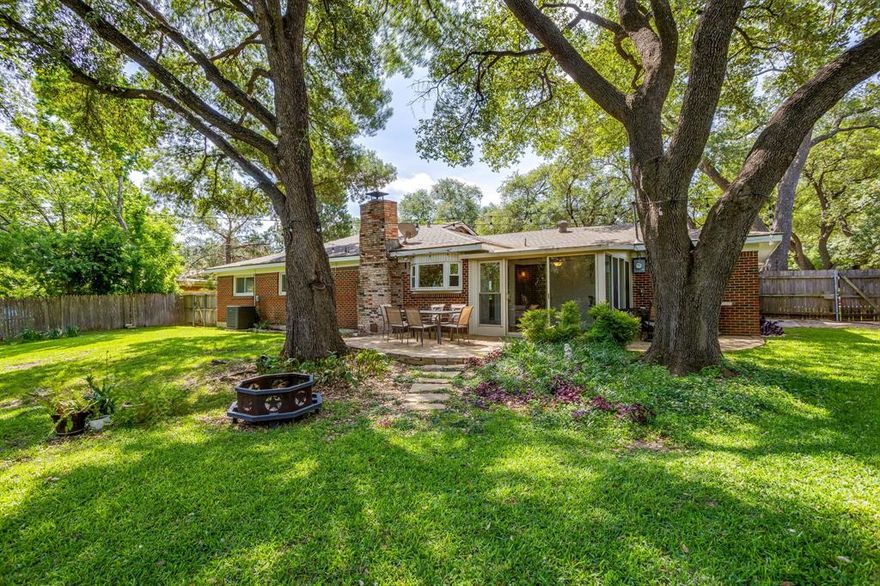 Beneath a canopy of towering, mature live oaks, this property welcomes you with a sense of timeless beauty and peaceful charm that’s hard to find. The front yard immediately makes a statement, massive shade trees stretching wide across a beautifully maintained lawn, creating a park-like setting that feels both grand and inviting. It’s the kind of place where mornings start slow with coffee under the trees and evenings are spent enjoying the breeze as sunlight filters through the branches. Step inside, and the home continues that warm, inviting feel. Large windows throughout allow natural light to pour in, while also framing views of those incredible trees from multiple rooms, bringing the outdoors in. The layout feels functional and comfortable, with generous living spaces designed for both everyday living and hosting family and friends. The kitchen offers plenty of workspace and storage, making it ideal for gatherings, while the adjoining dining and living areas create an easy, open flow. The bedrooms are well-sized and provide a quiet retreat, while the bathrooms are beautifully updated. An enclosed heated and cooled enclosed flex space offers added office space! Out back is where this property truly shines. The backyard opens up into a huge, usable space framed by more mature live oaks. Whether you’ve dreamed of building out a garden, adding raised beds, creating an outdoor entertaining area, there’s room here to do it all. It’s rare to find a yard this large, and this beautiful all at once. Location is another highlight. Just minutes away is Leonard Park, a local favorite with scenic walking trails, open green space, playgrounds, and picnic areas, perfect for enjoying the outdoors without going far. This property offers something that’s getting harder and harder to find—mature trees, meaningful outdoor space, and a home that feels connected to its surroundings. It’s not just a place to live… it’s a place to slow down, spread out, and truly enjoy where you are.