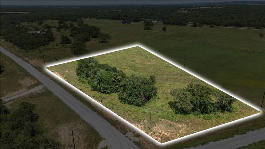 Prime 2.33-Acre Corner Lot in The Ranches of BlackJack Meadows – 779 Blackjack Pkwy, Lot 29

Discover the perfect blend of space, privacy, and convenience with this exceptional 2.33-acre corner lot in the highly sought-after Ranches of BlackJack Meadows. Situated on a premium corner location, this homesite offers multiple possibilities for driveway placement and home orientation, maximizing both curb appeal and functionality.

Surrounded by mature native trees, this property provides a peaceful and picturesque setting, ideal for creating your dream home. The well-maintained, wide paved roads make access easy, adding to the overall charm and accessibility of the community. With electricity available and fiber-optic internet ready, you’ll have all the modern utilities needed to build with ease.

Enjoy the serenity of country living while staying connected and within reach of nearby conveniences. This is a rare opportunity to own a prime corner lot in a stunning community!

Call today to schedule a visit and envision your future on Lot 29!