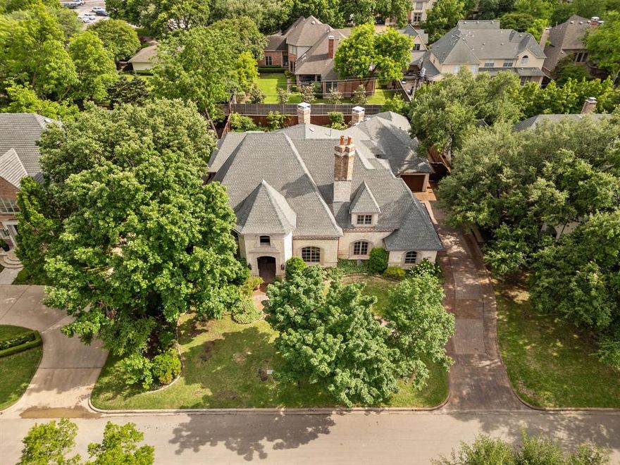 New Price. Refreshed. Staged. Fabulous Executive Home in the heart of Preston Hollow. Located on a premier block in the Golden Corridor between Preston and Hillcrest. Lot is third of an acre!! Great drive-up appeal. A meticulous build with attention to luxury detail- hand scraped hardwoods, big solid doors, luxurious moldings, big windows, a PERFECT flow for entertaining. 
First floor: Large primary bedroom suite, Guest suite, Library-Study, Media room, 2 half baths, Chef’s kitchen, Bar, Formal Dining & Living, Mud & Utility rooms. The Great Room has fabulous views of the back yard with outdoor living, kitchen & pool-spa. Upstairs: 3 ensuite bedrooms, Game room and Workout room. All 5 bedrooms have ensuite baths and ceiling fans. The awesome 3 car Garage has electric car charger, custom cabinets & beautiful epoxy floors. Located near high end Shopping, fabulous Restaurants, Tollway, Central Expwy, Love Field & DFW airports - and of course near many highly ranked private Schools.