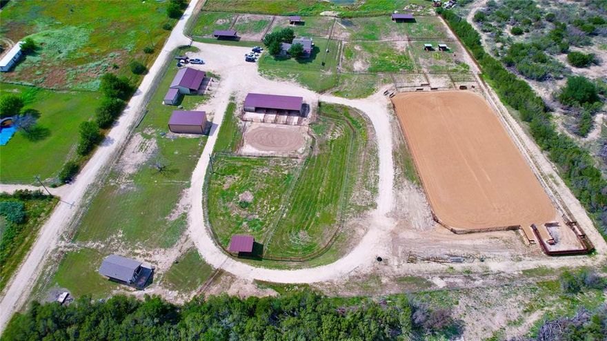 Bring your horses!! This turn key horse property sits on 7.26 acres, 4 stall shed row barn featuring all pipe oversized runs with automatic waters the second 4 stall barn also consists of all pipe oversized runs, automatic waters, an attached concrete floor workshop, rollup doors, equipment parking, and plenty room to spare for tack and feed. The main 3 bed 2 bath 1,185 sq ft home with hardwood flooring, fenced yard and a great covered patio to sit on with a clear view of the entire property. The high efficiency guest house features a 1 bed 1 bath open floor plan. 9 turnouts consisting of all pipe, cable and high tensile wire. A 30'x40' equipment-hay barn, a RV pad power and water hookup as well as a sewer dump for your horse trailer or camper. The arena is 140'x250' all pipe and cable with water and power ran to both ends and some of the best sand anyone could possibly want to ride or rope in.