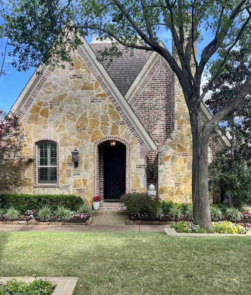 BEAUTIFUL & CHARMING TUDOR STYLE COTTAGE NESTLED IN METICULOUSLY MANICURED, GATED CAMBRIDGE GATE! The updated interior of this quaint, low maintenance energy efficient home boasts hand scraped hardwoods, granite countertops & new stainless appliances. A walk-in pantry & vaulted ceilings, adorned with skylights, fill this delightful home. A welcoming space unfolds in the living room featuring built-ins & connects to an adjacent dining area. The guest suite & full bath are tucked away in the front of the home offering convenience & privacy for guests. Spacious primary suite includes an elegant bathroom featuring a double vanity, a double seamless glass shower, granite counters & a large walk-in custom closet. A large third bedroom or multifunctional space off the kitchen features a closet and built in workspace. Access to the custom epoxy floored garage with overhead shelves & completely floored attic completes the functionality of this versatile space. French doors invite you to step out onto the flagstone patio where a double-sided gas log fireplace creates a cozy ambiance & natural flow between indoor & outdoor living. The courtyard is beautifully landscaped with lush, layered foliage & the crystalline trickle from dual water fountains. Cambridge Gate is a special enclave of only 55 homes with beautifully manicured lawns & green spaces, offering a peaceful, secure setting where luxury & casual elegance blend seamlessly. Great neighbors & neighborhood events will help you easily feel at home. Convenient to shopping, outstanding restaurants, and major freeways.