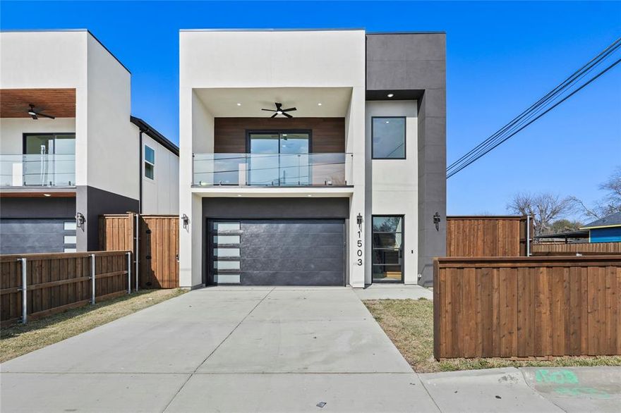 Welcome to this stunning new construction just minutes from Downtown Dallas. This home combines modern elegance with high-end finishes, offering a luxury feel without the luxury price tag. As you enter, you're greeted by a striking modern chandelier and LED sensor-lit stairs, leading you into a sophisticated dining area featuring a beautiful wine showcase. The chef-inspired kitchen boasts dark gray cabinetry paired with warm earth tones and luxurious Taj Mahal countertops. The open-concept living room impresses with soaring 21-foot ceilings and a beautiful fireplace, creating a dramatic and welcoming space. The spacious master suite and bedrooms continue the modern, upscale design. Upstairs, enjoy a large bonus room with a balcony, plus an additional family area overlooking the main living space perfect for entertaining or relaxing. Step outside to your covered patio with an outdoor grill kitchen and ceiling fan, all within a fully fenced yard with 8 foot privacy fencing, ideal for peace and seclusion. Next door, 1507 Dennison St is also available for showing, featuring lighter kitchen cabinets.  Don't miss your chance to own a stylish, modern home minutes from the heart of Dallas.