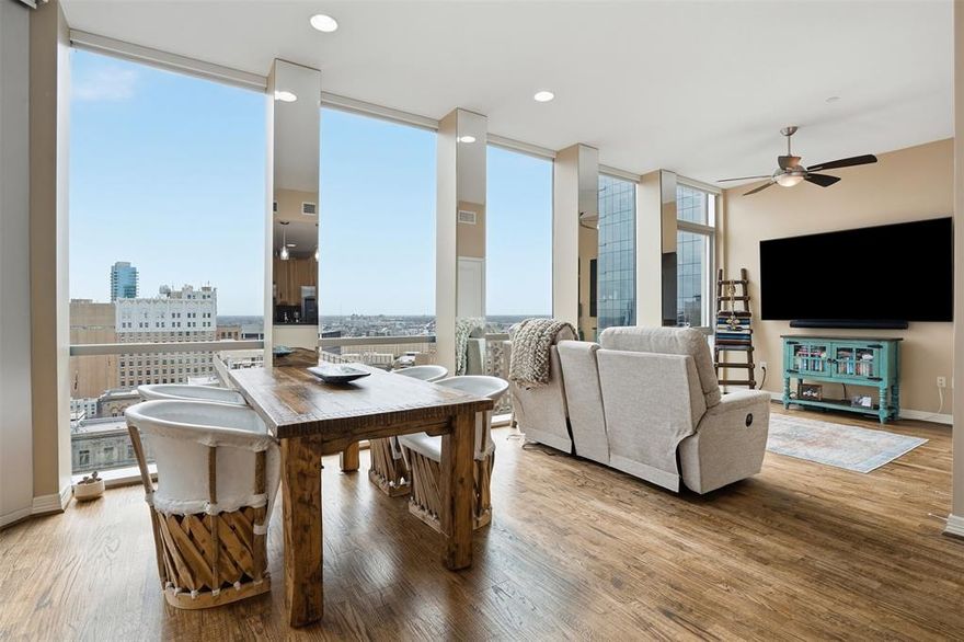 Experience elevated urban living on the 21st floor at The Tower in downtown Fort Worth. This Texas urban style one-bedroom residence offers two full baths plus a dedicated office, ideal for modern city living.  Also included are two deeded parking spaces
Floor-to-ceiling windows and 10-foot ceilings flood the home with natural light and showcase sweeping city views from the bedroom, living, and kitchen areas. Rich wood flooring, a sleek kitchen with stainless steel appliances, and an LG washer and dryer complete the polished interior. The private bedroom suite features a custom closet system and a well-appointed ensuite bath, creating a comfortable retreat above the city.
Tower amenities include a 24-hour concierge desk, deeded parking, outdoor pool and spa, party room, outdoor grills and dining terrace, putting green, dog park, and multiple gazebo sitting areas. Ideally located just blocks from the Trinity River Trails and steps away from premier dining, entertainment, and business venues—this is downtown living at its finest.