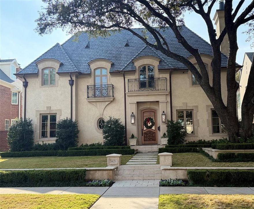 Experience elevated living in this immaculate Highland Park home, blending luxury and livability just steps from Armstrong Elementary. Designed to feel both sophisticated and relaxed, the home offers an open floor plan ideal for effortless entertaining. With 5 bedrooms, 6.2 baths, and five fireplaces, the interiors are richly appointed. The chef’s kitchen features Wolf appliances, a built-in SubZero refrigerator, and a Miele coffee machine, while a unique wine cellar connects both the formal dining room and kitchen.

The gorgeous, spacious primary suite provides a serene retreat. Beyond the main living areas, you’ll find leathered bar ceilings, French doors opening to artificial turf, and beautiful landscaping, creating an inviting indoor–outdoor flow. The home sits on a generous 65 x 150 lot, offering exceptional space and privacy.

A detached back house includes a golf simulator and movie theater, not counted in the home’s square footage, and can be converted back to a three-car garage if desired. Additional features include a built-in grill, camera system, and integrated audio throughout.

A remarkable opportunity to enjoy refined comfort and premier walkability in the heart of Highland Park.