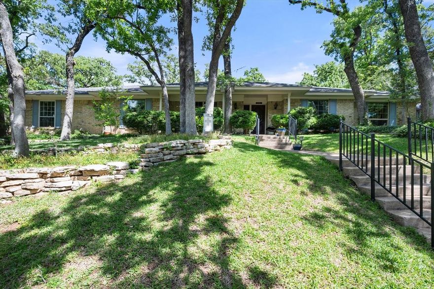 MULTIPLE OFFERS RECEIVED - Seller is requesting highest and best by 12pm, Thursday, May 7th.   Spacious single-story offers rare opportunity to enjoy peaceful, nature-filled setting on nearly acre lot. Curb appeal makes lasting impression w layered stone landscaping, mature oak trees and welcoming covered front porch. One of the standout features of property is incredible five-car covered parking, making it true find for car enthusiasts, hobbyists or anyone needing extra space. In addition to rear-entry two-car garage, ideal for projects or woodworking; you’ll find well-built, expansive three-car carport that also offers attic storage, flexibility for gatherings or extended use. Thoughtful, flexible layout designed for both everyday living and entertaining. Just off main living areas, private office w built-ins provides perfect work-from-home setup; or, easily functions as  fourth bedroom. Multiple living and dining spaces create options for hosting, relaxing or multi-generational living. Main living room w cozy brick fireplace, raised hearth and built-ins, flowing seamlessly into light-filled sunroom; ideal spot for morning coffee or unwinding taking in views of lush, tree-lined backyard. Kitchen well-appointed w 42-inch cabinets, gas cooktop, generous counter space, breakfast bar and  adjoining breakfast nook. Primary suite offers comfortable retreat w ensuite bath w separate vanities, garden tub and walk-in closets. Two additional bedrooms w built-ins, ample storage and full bath conveniently located nearby. Outside w large deck and covered patio, perfect for entertaining or enjoying quiet evenings surrounded by nature. Terraced backyard creates peaceful outdoor escape w room to explore, garden or simply relax. Bonus feature includes several Pella windows, some accented w Bali blinds. Conveniently located just minutes from elementary school, shopping, dining, parks and entertainment. Home blends natural beauty w everyday accessibility.