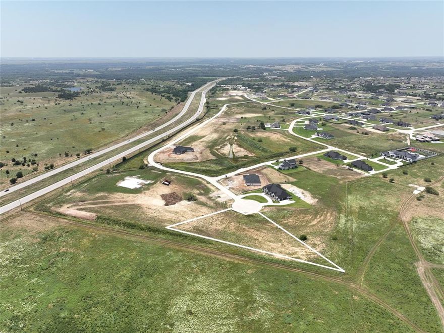 Situated at the crown of a cul-de-sac, this 1.26-acre lot is ready for your future 3,200 minimum square foot home! Build on your timeline with your builder of choice in one of the last remaining lots in Bella Crossing.  Survey is available to the buyer for convenience. Live close to restaurants, shopping, and entertainment without the Fort Worth city taxes. Explore the possibility of living within the Bella enclave!