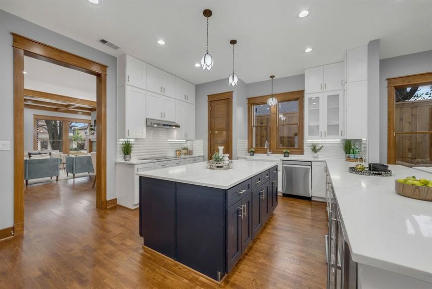 Thoughtfully designed new construction offering modern comfort, craftsmanship, and low-maintenance, lock-and-leave living in one of East Dallas’s most walkable neighborhoods near Lower Greenville. The home features a pier-and-beam foundation with insulation and warranty, Pella energy-rated windows, enhanced sound and thermal insulation, custom built-ins, five-panel solid doors, fully trimmed windows and doors, and quartz countertops throughout. Living spaces are anchored by gas fireplaces indoors and out and highlighted by handcrafted stained-glass windows by a local artisan, along with Motawi tile and restored vintage lighting that add warmth and character. The chefs smart kitchen includes an induction cooktop, double smart oven with convection and air-fry, warming drawer, wine refrigerator, and a smart home-hub refrigerator. Bluetooth-enabled appliances, programmable systems, USB USC outlets, electronic exterior locks, and EV-ready garage wiring support modern living. The primary bath features heated floors. A private rear porch with mechanized screens and low-maintenance, pollinator-friendly landscaping make this home especially well suited for a lock-and-leave lifestyle. This is the kind of neighborhood where neighbors become friends—mornings filled with dog walks, coffee runs, and kids heading to school, all with easy access to parks, dining, SMU, White Rock Lake and Downtown Dallas. Call agent for access.