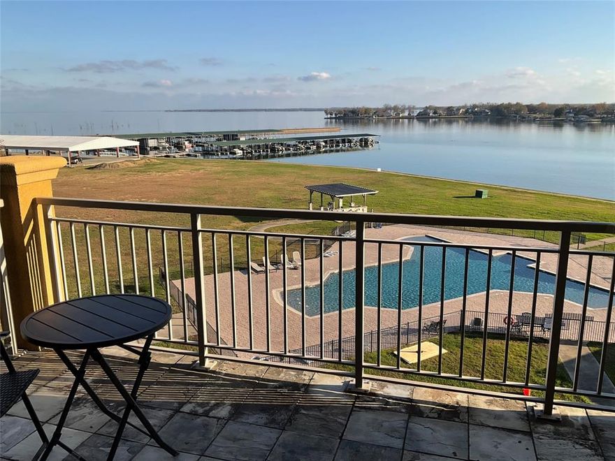Come view this much sought after fourth floor Condo! What a way to start your day! The Windjammer Floorplan features master bedroom with lake view! You'll enjoy resort style living with great amenities: club house, fitness room, pool and business center! Marina, marina store, boat launch and restaurant are right next door! This Condo with a fabulous view has 2 Bedrooms, 2 Baths and a nice covered patio.  The kitchen and baths feature granite counters! There is a large island and the kitchen is equipped with dishwasher, disposal, microwave, range, side-by-side refrigerator and full-sized washer & dryer!