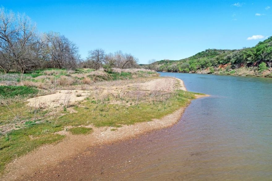 Now presenting a RARE opportunity to own your very own Brazos River paradise, located just five miles west of Mineral Wells in beautiful Palo Pinto County. Properties of this size with private river frontage do not sell often. This property features a custom hilltop home with breathtaking views of the Brazos River Valley and Palo Pinto County hill country. The landscape consists of some ridgeline with rolling prairie all the way down to over 462 feet of premium, gradually sloping Brazos River Frontage! This place has it all! Hunting, fishing, livestock... with over 53 ag exempt acres to work with, you can make all of your dreams come true. Wildlife are abundant with tons of fresh deer tracks everywhere. The 1,485 sq ft home is situated nicely to allow for lots of privacy, peace and quiet and stunning views. The home features a large open concept floor plan with vaulted ceilings, huge bedrooms, en-suite bathrooms and walk in closets! Tons of space! Must see in person!