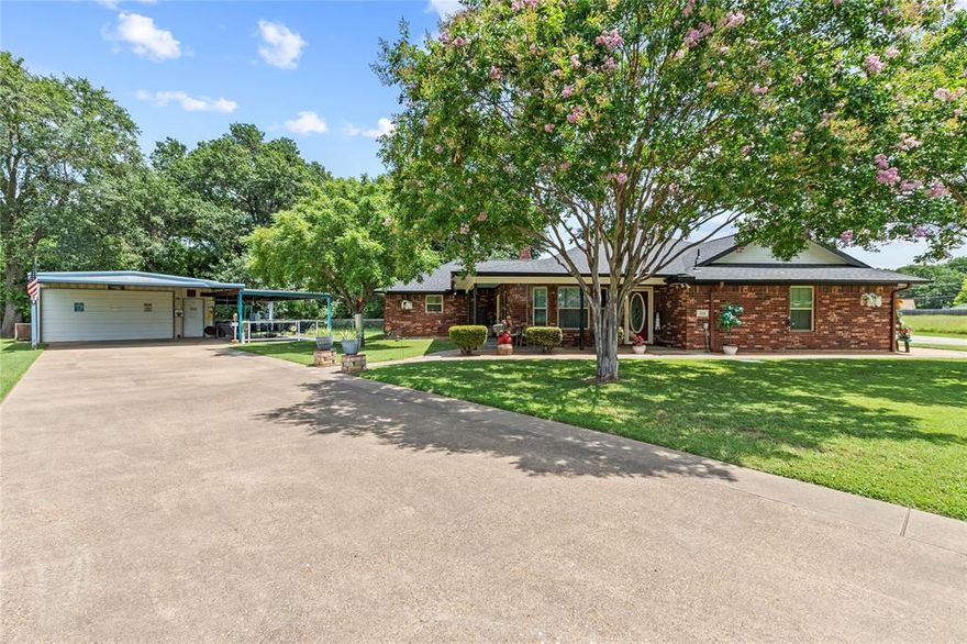 Exceptionally well maintained home on over half an acre with over sized 2 car garage plus 460 sq ft shop and covered RV parking with electric hook up.  Set on two spacious lots, the 3-bedroom, 2-bathroom home features an open-concept layout with recent updates, including a brand-new roof in 2024. An RV carport with electrical hookups and generous parking space make it easy to accommodate guests, trailers, watercraft and extra vehicles. In addition to the oversized 2 car garage, there is also a 460 sq ft two-bay shop equipped with HVAC, a heat pump, and water access, making it ideal for not only vehicle parking but also storage or hobby use. A 235 sq. ft. covered patio extends the living space outdoors, creating a great spot for entertaining. Located just steps from the community boat launch, the property offers quick access to the lake for boating, fishing, and water fun. Its prime location in Gun Barrel City combines the ease of lake life with convenient access to HWY 175, making trips to Dallas or weekend visits a breeze. Whether you're searching for a full-time residence or a low-maintenance second home near the water, this property offers a flexible layout, excellent amenities, and an unbeatable location.