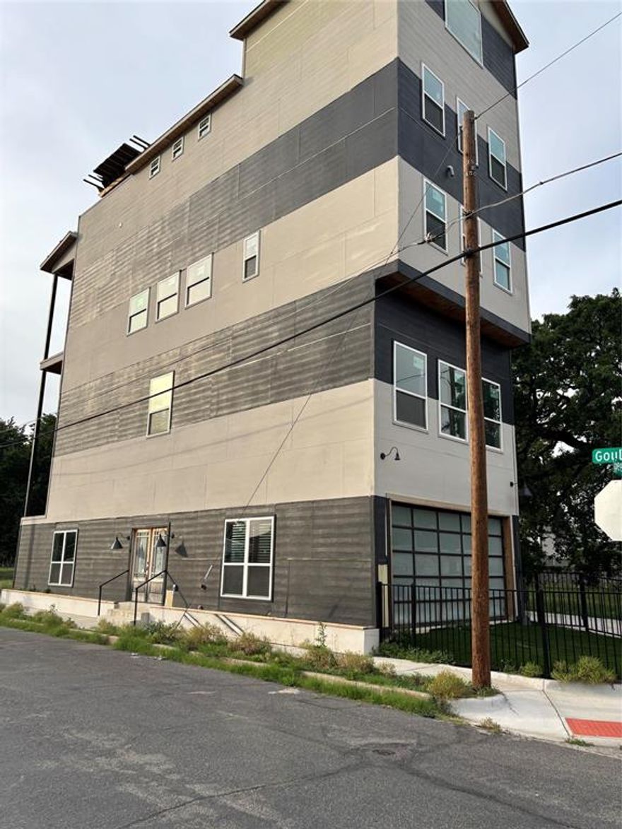 Rare opportunity to own a 5-story detached townhome just minutes from downtown Dallas with endless potential for customization. With 5 bedrooms and 5.5 bathrooms, this property is ideal for investors, developers, or buyers looking to bring their vision to life. The first floor includes a private studio space with its own kitchen and laundry setup—great for future rental income or guest use. The rooftop terrace and balcony offer stunning views of the Dallas skyline. A shaft is in place for a potential elevator or can be repurposed for storage or a pantry. Additional features include paid-off solar panels, a top-floor loft plumbed for a wet bar or sink, and a garage conversion with stacked parking capability. A commercial-grade fire sprinkler system has been installed. Property is partially completed and offers a unique opportunity to build out to your taste. Sold as-is. Convenient location near downtown attractions, dining, and entertainment. Buyer’s agent to verify all information as accurate.