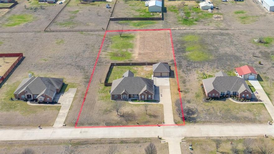 On 1.5 acres-Outside City Limits-No HOA-Rockwall ISD! This spacious property has ton of potential and boasts 5 large Bedrooms! The bonus room and 5th bedroom were added in 2020! Tall Ceilings and Tons of Storage! The backyard is fenced in and the acreage is in the back of the property! The 30x30 Workshop has Electricity 110 and 220 as. It can easily park 2 additional cars. A great property with Great Bones and Mechanicals needing a little bit of TLC !
