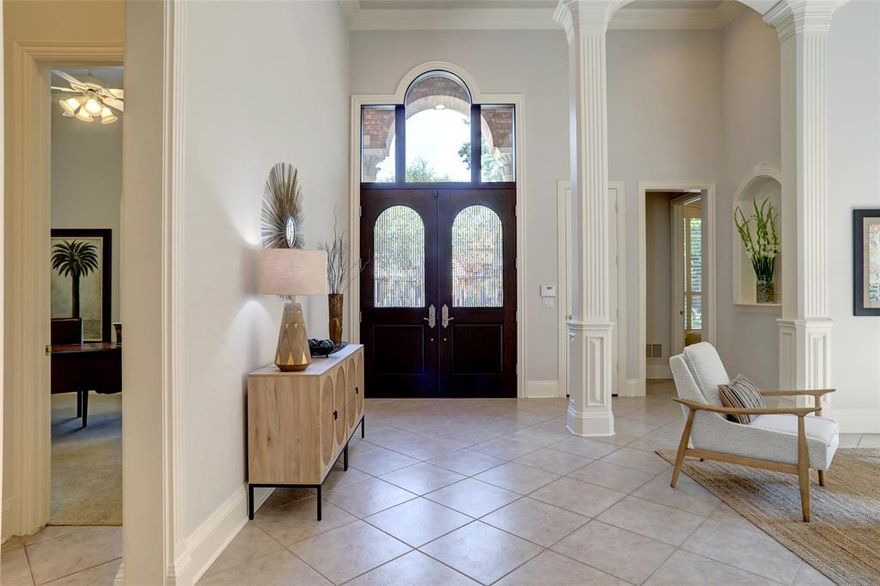 Fresh, Clean & Exceptionally Crafted One-Story Custom Home with two living areas. Experience refined living in this stunning one-story Steve Roberts custom home where timeless craftsmanship meets a move-in-ready feel. Located in a quiet, gated enclave of just 20 homes, this residence showcases dramatic 10–16' ceilings, oversized brick, solid core doors, and exquisite hand-cut crown molding, arches, and columns—true attention to detail throughout. Enjoy peace of mind with a 50-year stone-coated metal roof (2024), updated gutters with leaf guards, and thoughtful upgrades designed for comfort and longevity. Large windows fill the home with natural light, enhancing the bright, open layout  while maintaining excellent bedroom privacy. The fully remodeled primary bath is a spa-like retreat featuring Taj Mahal quartzite, an Air Masseur hydrotherapy tub, and elegant finishes. Secondary baths updated with quartzite countertops. The chef’s kitchen offers black stainless appliances, water filtration at the sink, under-cabinet lighting, abundant cabinetry, and a walk-in pantry, seamlessly connecting to the dining and living spaces. Additional highlights include a Baldwin mortise lock system, wall safe, tankless water heater, dual HVAC zones, surround sound in living and dining areas, and fiber optic availability. Storage abounds with generous interior space plus a floored attic with upgraded attic stairs. Outdoors, enjoy a large covered patio, tasteful up-lighting, and a low-maintenance yard—perfect for relaxing evenings or entertaining. Conveniently located near LBJ, Dallas North Tollway, George Bush Turnpike, and within walking distance to the private Shelton School. This home blends luxury, function, and a fresh, clean aesthetic in an unbeatable location—truly a standout opportunity.