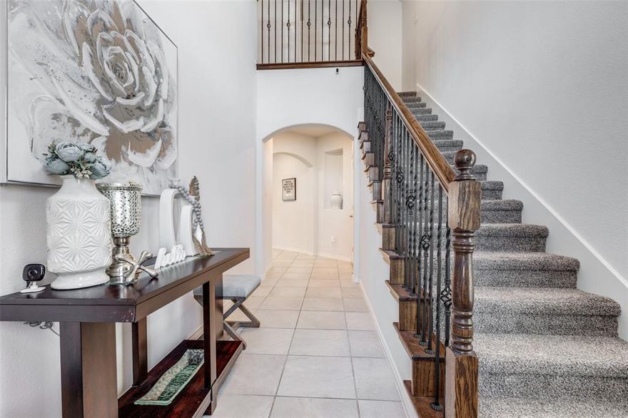 Welcome home to this beautifully designed north-facing residence, ideally positioned across from a wide-open green space that offers peaceful views and a sense of privacy. Located in a central McKinney location, this home provides easy access to the tollway, shopping, restaurants, and the popular PGA Headquarters.
Inside, soaring ceilings and a striking ceramic tile entry create an impressive first impression. The open floor plan seamlessly connects the main living spaces, making it ideal for both everyday living and entertaining. The spacious living area features a cozy gas fireplace and abundant natural light.
The kitchen is thoughtfully designed with stainless steel appliances, a double sink, generous breakfast bar, and a standout 5-burner gas range vented to the exterior, perfect for home chefs. The layout offers both functionality and an open connection to the living area.
The primary bedroom is located on the main level, providing a private retreat with comfort and convenience. Upstairs, there are 3 additional bedrooms, one currently being used as a office and can easily serve as a game room, media room or second living area.
Step outside to enjoy a roomy backyard with a nicely sized covered patio, perfect for relaxing or entertaining. The patio is wired for audio, creating an ideal setting for outdoor dining, gatherings, or quiet evenings at home.
Natural light flows throughout the home, enhancing the open and inviting feel. 
Adding to its appeal, the property is zoned to highly sought-after Prosper ISD, offering excellent educational opportunities while enjoying the convenience of McKinney living. Neighborhood amenities include a community clubhouse and resort-style pool area, perfect for social gatherings, relaxation.
With its desirable layout, impressive kitchen features, flexible living spaces, outdoor entertaining area, and prime location near major conveniences and entertainment, this home offers an exceptional North Texas lifestyle.