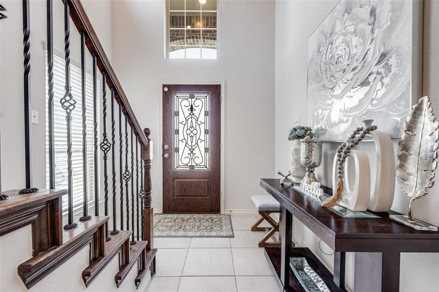 Welcome home to this beautifully designed residence, ideally positioned across from a wide-open green space that offers peaceful views and a sense of privacy. Located in a central McKinney location, this home provides easy access to the tollway, shopping, restaurants, and the popular PGA Headquarters.
Inside, soaring ceilings and a striking ceramic tile entry create an impressive first impression. The open floor plan seamlessly connects the main living spaces, making it ideal for both everyday living and entertaining. The spacious living area features a cozy gas fireplace and abundant natural light.
The kitchen is thoughtfully designed with stainless steel appliances, a double sink, generous breakfast bar, and a standout 5-burner gas range vented to the exterior, perfect for home chefs. The layout offers both functionality and an open connection to the living area.
The primary bedroom is located on the main level, providing a private retreat with comfort and convenience. Upstairs, there are 3 additional bedrooms, one currently being used as a office and can easily serve as a game room, media room or second living area.
Step outside to enjoy a roomy backyard with a nicely sized covered patio, perfect for relaxing or entertaining. The patio is wired for audio, creating an ideal setting for outdoor dining, gatherings, or quiet evenings at home.
Natural light flows throughout the home, enhancing the open and inviting feel. 
Adding to its appeal, the property is zoned to highly sought-after Prosper ISD, offering excellent educational opportunities while enjoying the convenience of McKinney living. Neighborhood amenities include a community clubhouse and resort-style pool area, perfect for social gatherings, relaxation.
With its desirable layout, impressive kitchen features, flexible living spaces, outdoor entertaining area, and prime location near major conveniences and entertainment, this home offers an exceptional North Texas lifestyle.