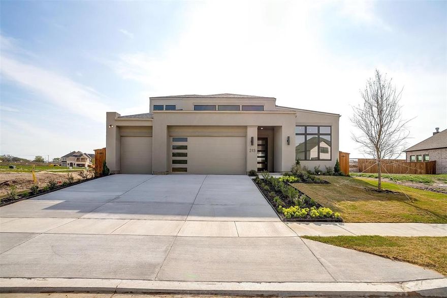 Ready Now! Welcome to your new dream home here in Aledo! This stunning Texas Transitional home is an architectural showpiece. Inside, you?ll find a modern, open-concept with high-end finishes and thoughtful design elements throughout. The gourmet kitchen is a chef's delight, equipped with top-of-the-line appliances and plenty of counter space. The home features a large covered patio which provides ample outdoor space for relaxation and entertainment. Each of the 4 bedrooms are a serene retreat, with the primary suite boasting a spa-like bathroom and walk-in closet. Spacious 3-car garage (with 8' tall garage doors!) offers plenty of room for vehicles and storage. Other custom touches include foam insulation, tankless water heater and 8-foot solid core doors. Located in Aledo ISD, adjacent to Tiger Woods Bluejack Resort. Gated with amenities coming soon.