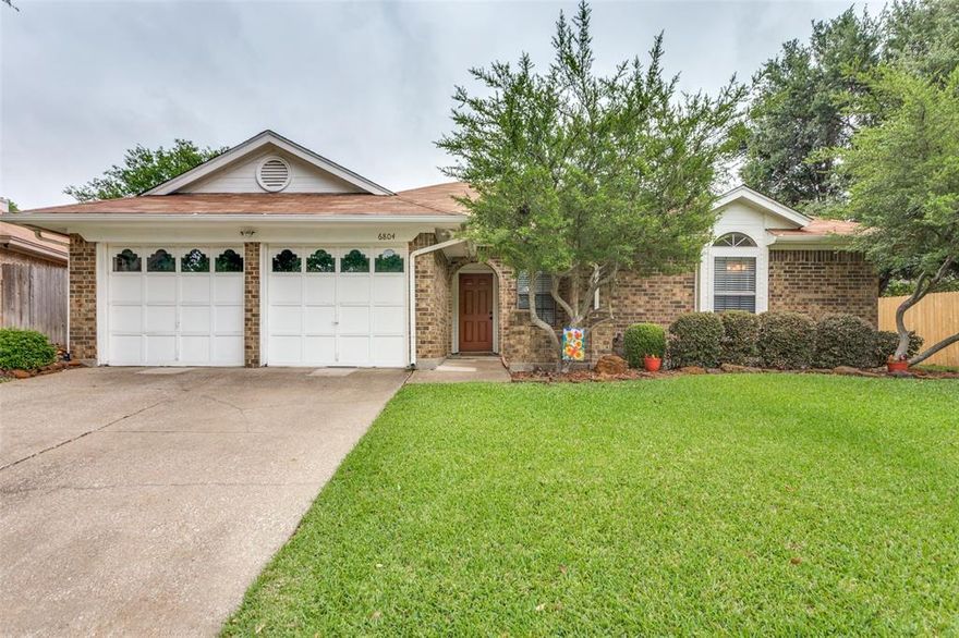 Charming, beautifully maintained brick home tucked away in a prime Fort Worth location on one of the largest lots in the neighborhood. Set on a pristine, landscaped quarter-acre lot, the backyard feels like a private retreat with mature greenery, peaceful views, and plenty of room to relax, entertain or add a future pool! Lovingly cared for by the same owner for the past 25 years, this home radiates pride of ownership throughout. Inside, spacious rooms, updated luxury plank flooring, fresh interior paint, and stylish lighting create a warm and inviting atmosphere with an easy, comfortable flow. The remodeled primary suite is a true escape, featuring an oversized jetted soaking tub, walk-in shower with designer tile and dual walk-in closets. The cozy living area, with vaulted ceiling and wood beam, is anchored by a wood-burning fireplace, while the inviting three season sun porch offers the perfect spot to enjoy morning coffee overlooking the beautiful backyard. Additional highlights include a separate laundry room with pantry, oversized two-car garage, abundant storage and closet space throughout, and a quiet neighborhood setting just minutes from shopping, dining, major highways, and downtown Fort Worth. Offering an exceptional combination of updates, lot size, and location, this home is an outstanding value in today’s market.
