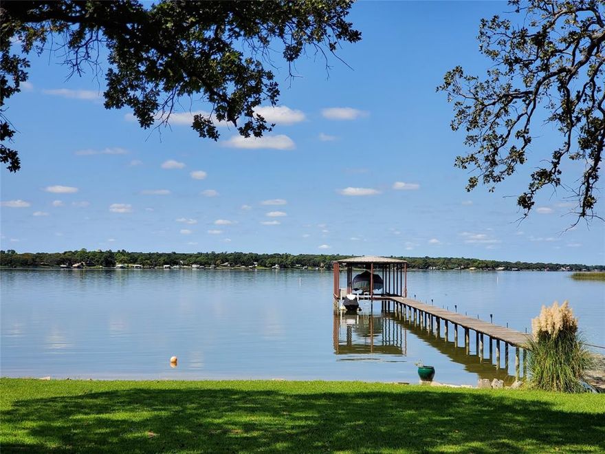 Beautiful WATERFRONT home on 1.4 acres with a boat dock and awesome open water views. FUN neighborhood. Your own sandy beach! (see pic) Granite countertops and stainless appliances. 3-2-3 +Office. +Game room is only room upstairs. (either can be converted to 4th-5th bedroom) Covered porches. Tile flooring. Bay windows. High ceilings. Sprinkler system. Dock with lift. WBFP. High quality build with excellent attic-roof radiant barrier. 

Plenty of room to add more buildings.

Golf cart, ATV friendly neighborhood!

BIG 3 car garage.

You can walk to neighborhood restaurant bar and grill that often has live music!

Move in ready. New AC 2020. New water heater 2023.


When COMPARING remember: Built 2008 (most others on this lake are much older) East side of lake (closer to DFW & civilization).

NO CITY TAXES, NO HOA, NO WATER BILL, NO SEWER BILL.

DFW airport 45 minutes; Stockyards; Downtown Fort Worth 25 minutes; Alliance Area 25 minutes; BNSF 20 minutes. Major shopping areas 15 minutes.