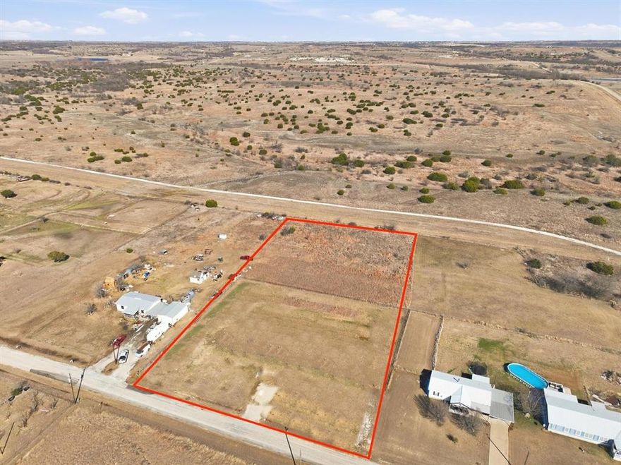 Come check out this beautiful improved 2.5 acre lot outside city limits ready for a new build or mobile home placement.  No neighbors in the rear with a pretty view of eastern Granbury. Lot comes with existing water meter and power. Lots like these rarely come up. Seller has vacant land survey in hand.